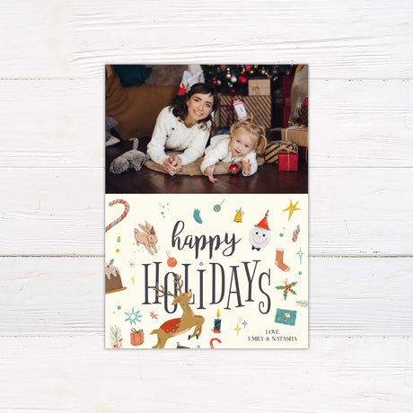 Happy Holidays photo card with family picture, festive illustrations of reindeer, bunny, snowman, gifts, holly, and personalized holiday greeting.