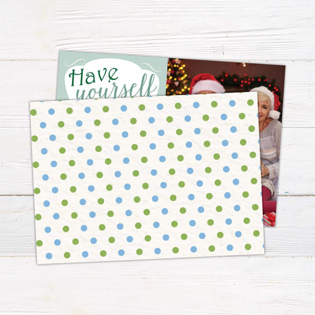 Have Yourself a Merry Little Christmas card with bold holiday typography in red, green, and gold alongside a personalized family photo. - back.