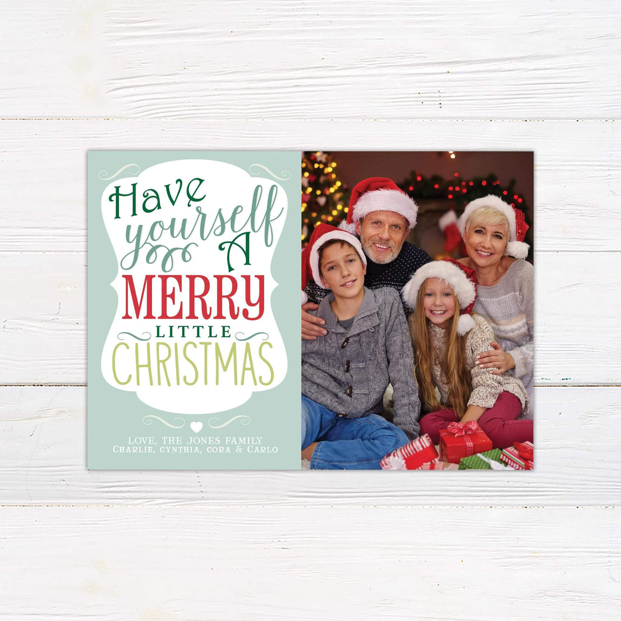 Have Yourself a Merry Little Christmas card with bold holiday typography in red, green, and gold alongside a personalized family photo.