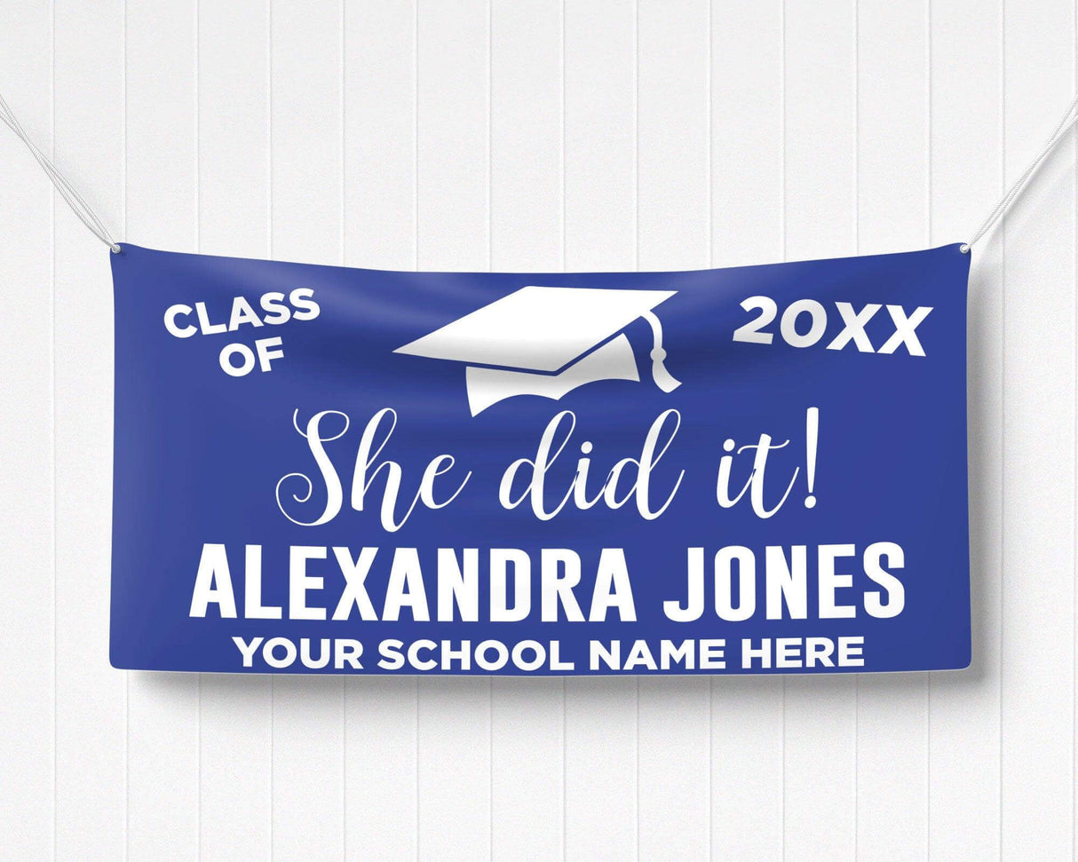 Bold "She Did It!" Graduation Vinyl Banner featuring a mortarboard cap, class year, and celebratory typography. Perfect for indoor and outdoor graduation decorations. Customizable colors and school name for any high school or college graduate. purple