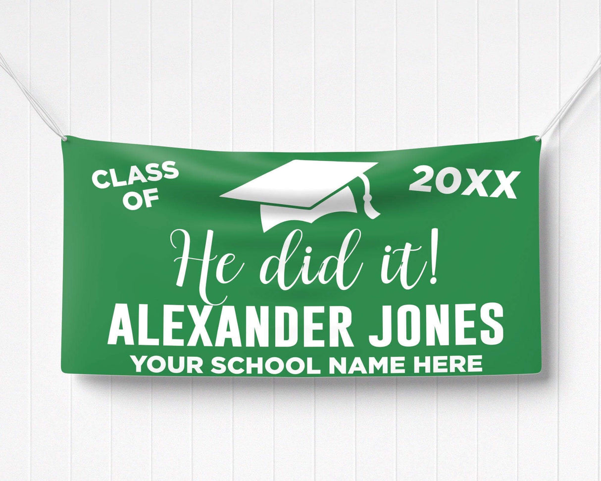 Bold "He Did It!" Graduation Vinyl Banner featuring a mortarboard cap, class year, and celebratory typography. Perfect for indoor and outdoor graduation decorations. Customizable colors and school name for any high school or college graduate. green