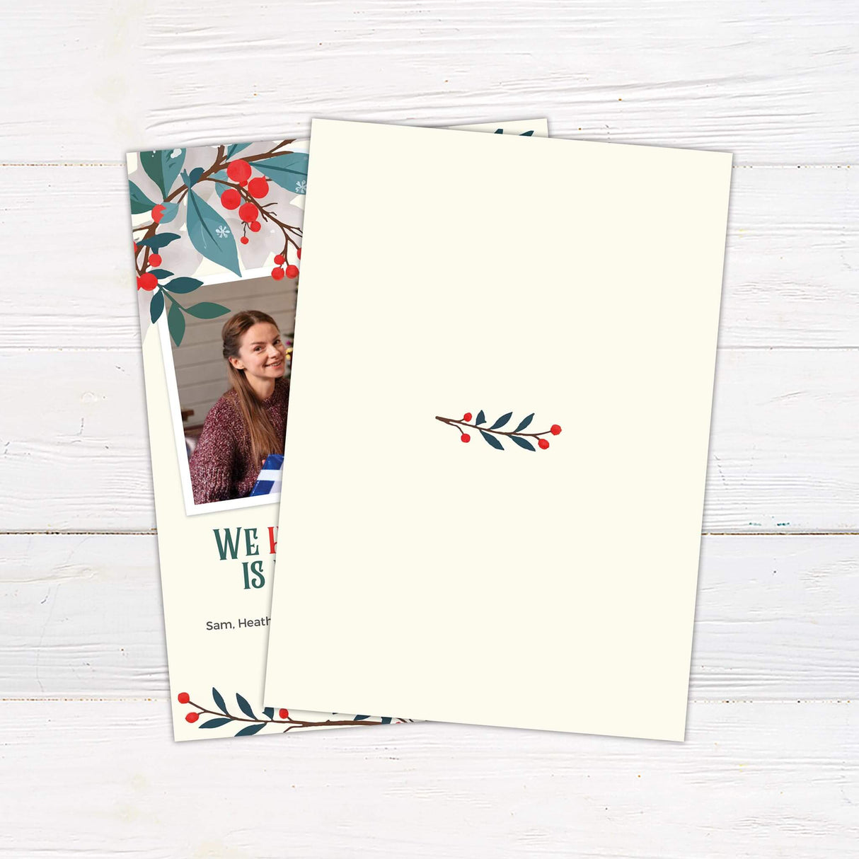 Holiday Floral  Christmas photo card with red berries and winter foliage framing a family photo and the message "We hope your holiday is filled with joy!" back side