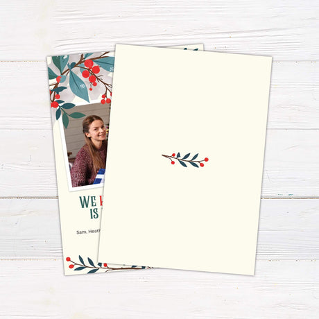 Holiday Floral  Christmas photo card with red berries and winter foliage framing a family photo and the message "We hope your holiday is filled with joy!" back side