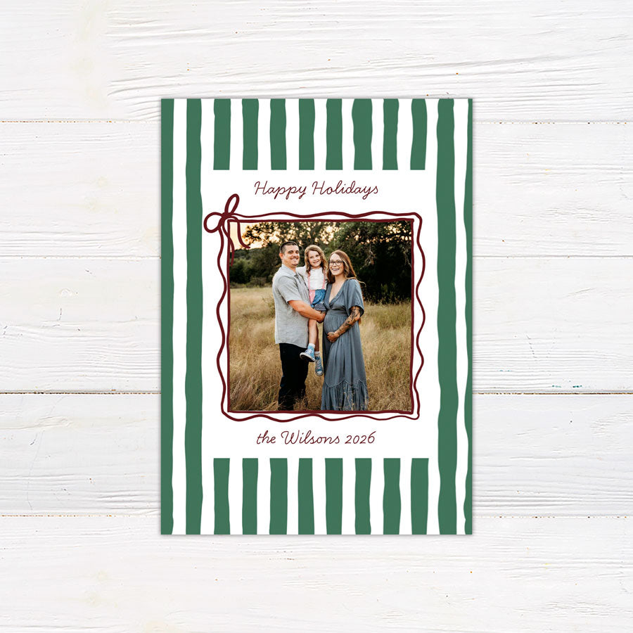 Personalized family holiday photo card featuring a bold hand-drawn striped border and centered family photograph. green