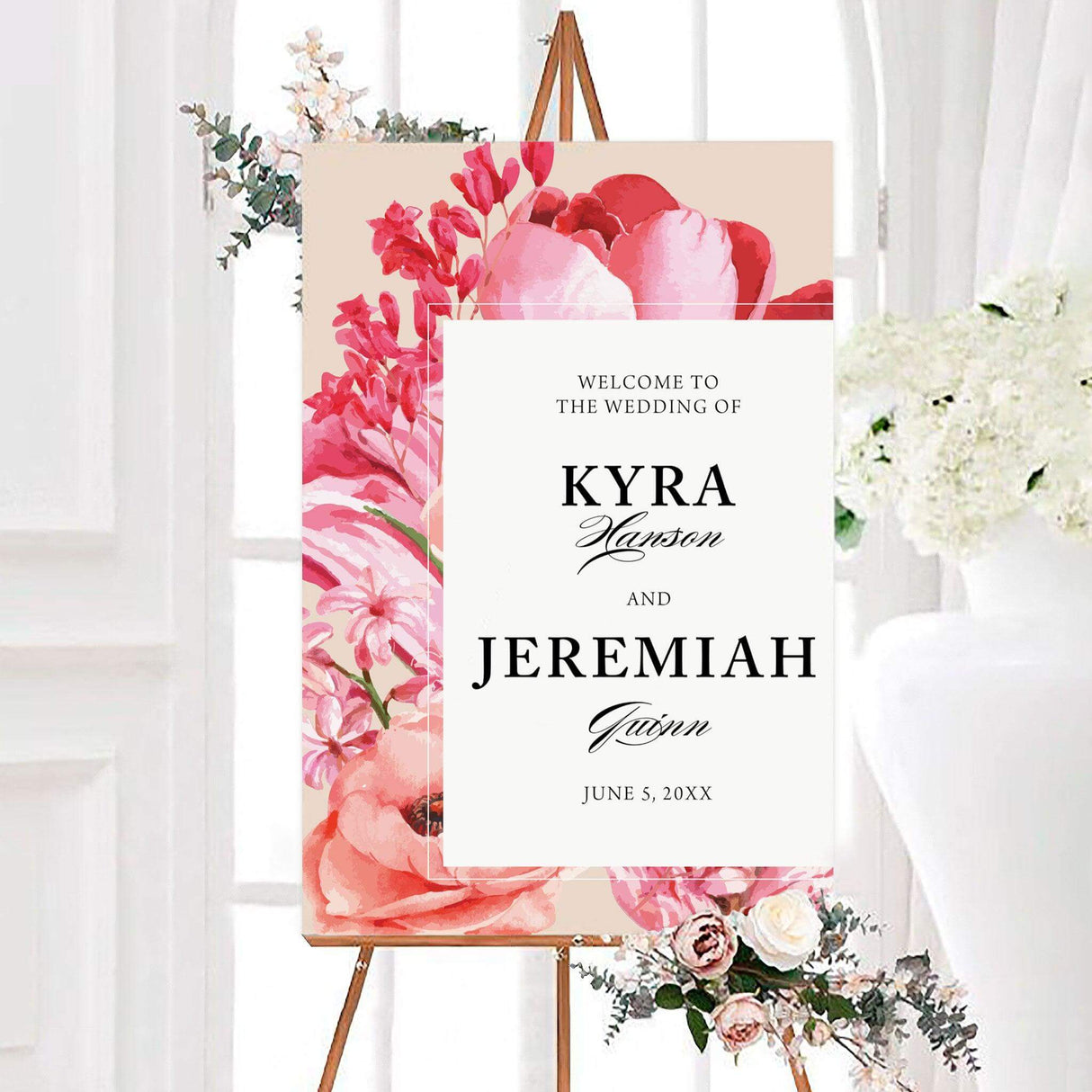 Hot pink harvest wedding welcome sign featuring bold watercolor-style flowers in hot pink, blush, coral, and red surrounding a white center panel. The personalized design displays the couple’s names and wedding date in elegant serif and script typography.