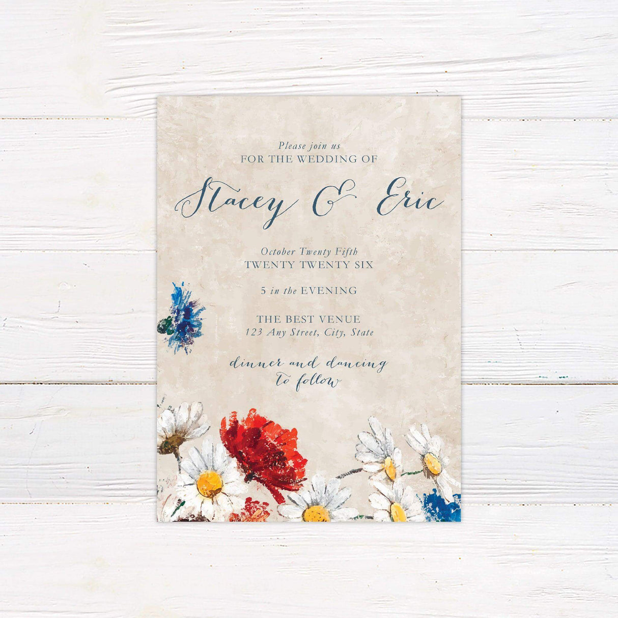 Impressionist-style wedding invitation with hand-painted wildflowers and elegant script on a rustic textured background.