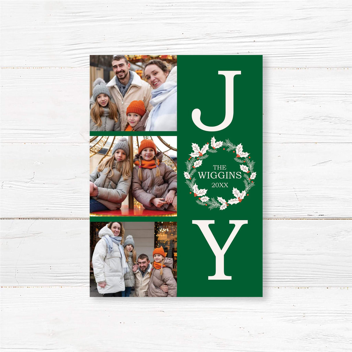 Customizable Joy Holiday Card featuring three photo slots alongside bold JOY lettering, with a festive holiday wreath as the “O” and a green snowflake background.