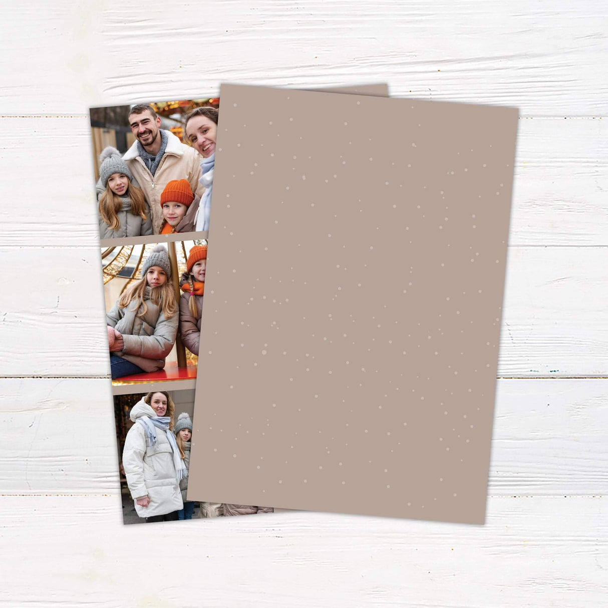Customizable Joy Holiday Card featuring three photo slots alongside bold JOY lettering, with a festive holiday wreath as the “O” and a taupe snowflake background. - back.
