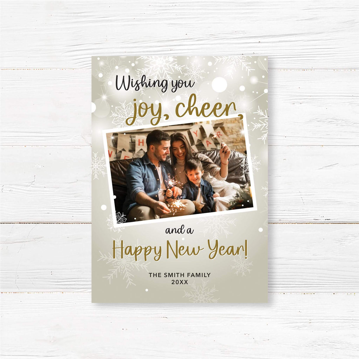 Personalized New Year photo card with snowflake design, featuring a family holding sparklers and “Wishing You Joy, Cheer, and a Happy New Year” greeting.