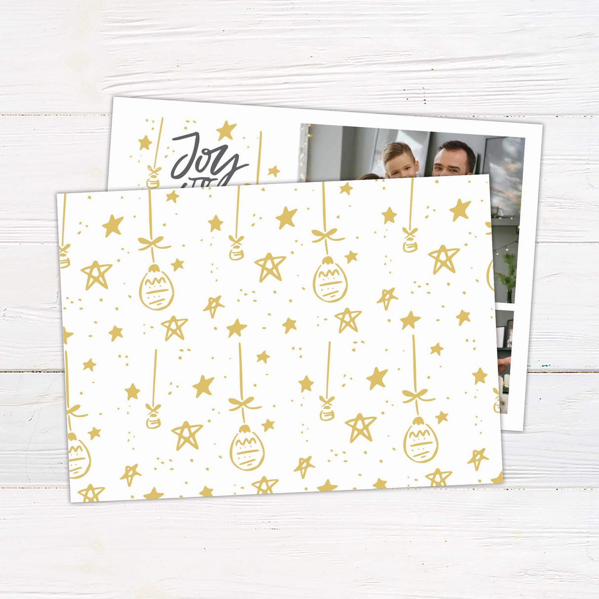 A customizable Christmas card featuring the phrase “Joy to the World” in gold lettering with festive star and ornament illustrations on one side and multiple photo slots on the other. The design allows families to showcase personal holiday photos in a modern and elegant style. - back.