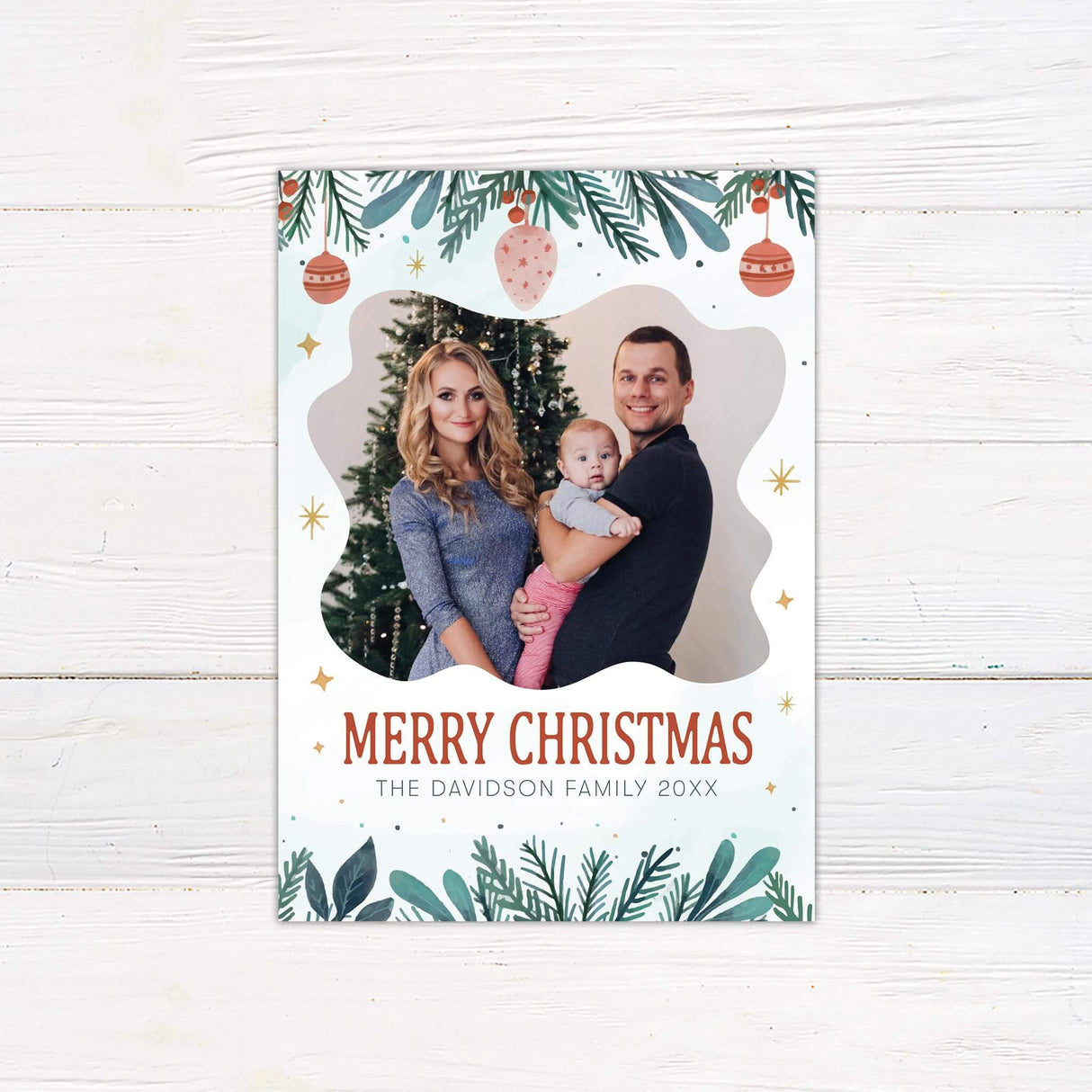 Joyful Watercolor Christmas card with family photo, painted greenery, ornaments, golden stars, and personalized Merry Christmas greeting.
