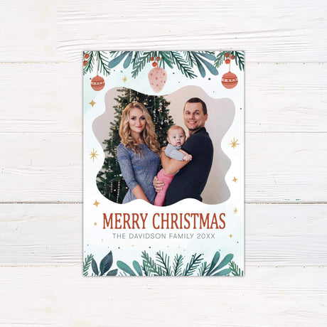 Joyful Watercolor Christmas card with family photo, painted greenery, ornaments, golden stars, and personalized Merry Christmas greeting.