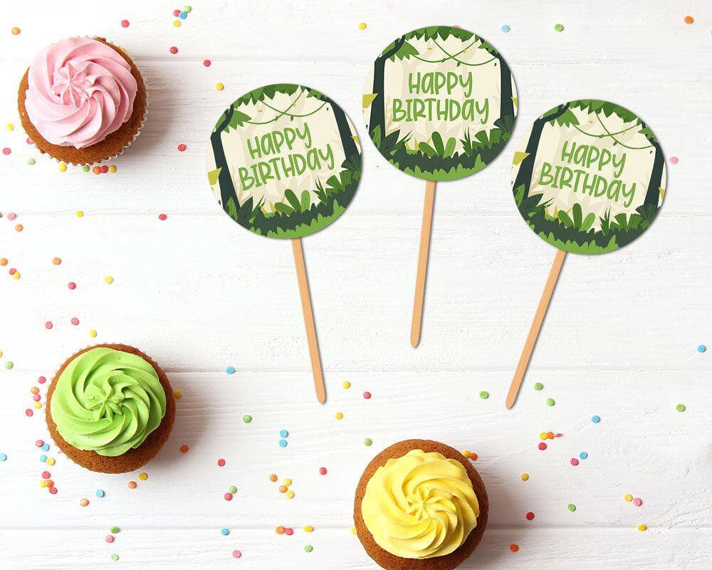 Jungle safari-themed cupcake toppers featuring green tropical leaves and adventure-inspired design. A fun way to decorate party desserts.