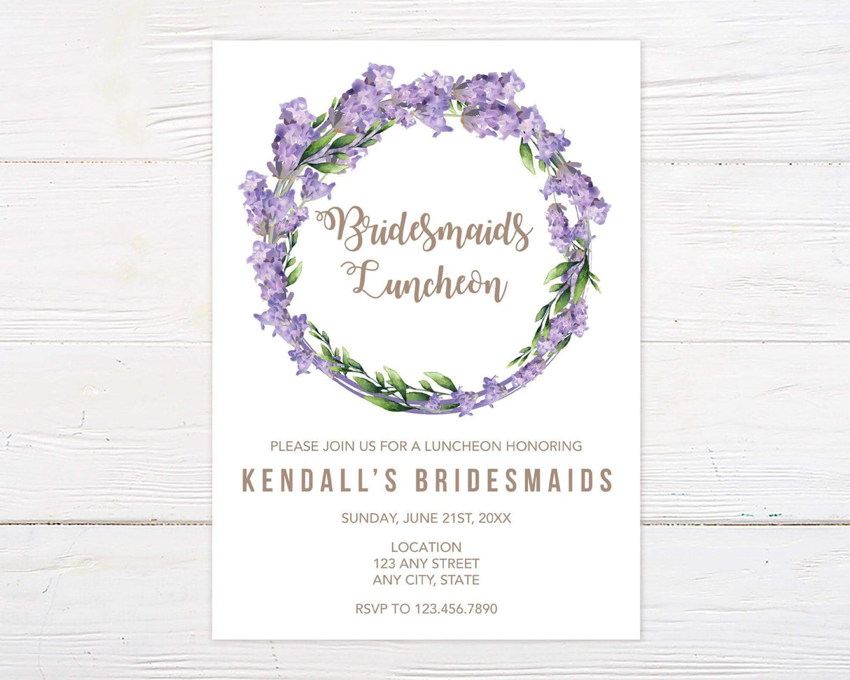 A Lavender Wreath invitation with a lavender floral wreath and circular design. The invitation features soft purple flowers and elegant lettering.
