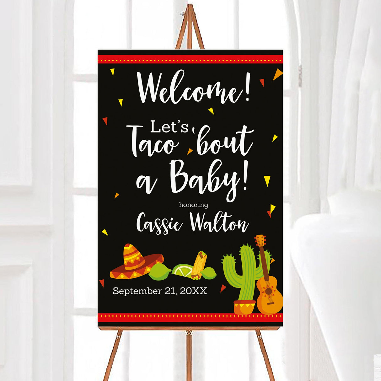 A fiesta-themed Let's Taco Bout a baby baby shower welcome sign with tacos, a sombrero, cactus, and guitar. The design uses bright colors on a dark background.