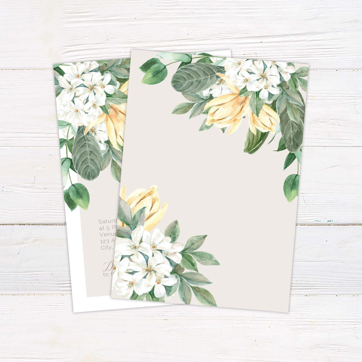 Light floral wedding invitation with watercolor white and yellow flowers and green leaves, featuring elegant modern script. back
