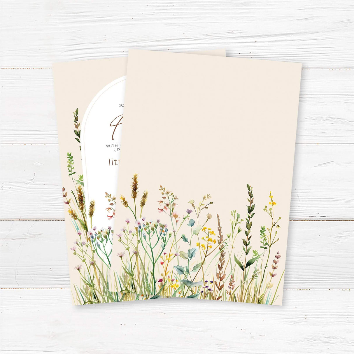 Printed wildflower baby shower invitation featuring an elegant arched frame with delicate watercolor boho floral illustrations. This rustic baby shower invite is fully customizable with event details, making it a perfect choice for a spring baby shower, floral baby celebration, or bohemian-themed gathering. Professionally printed for a polished and elegant look. Back.