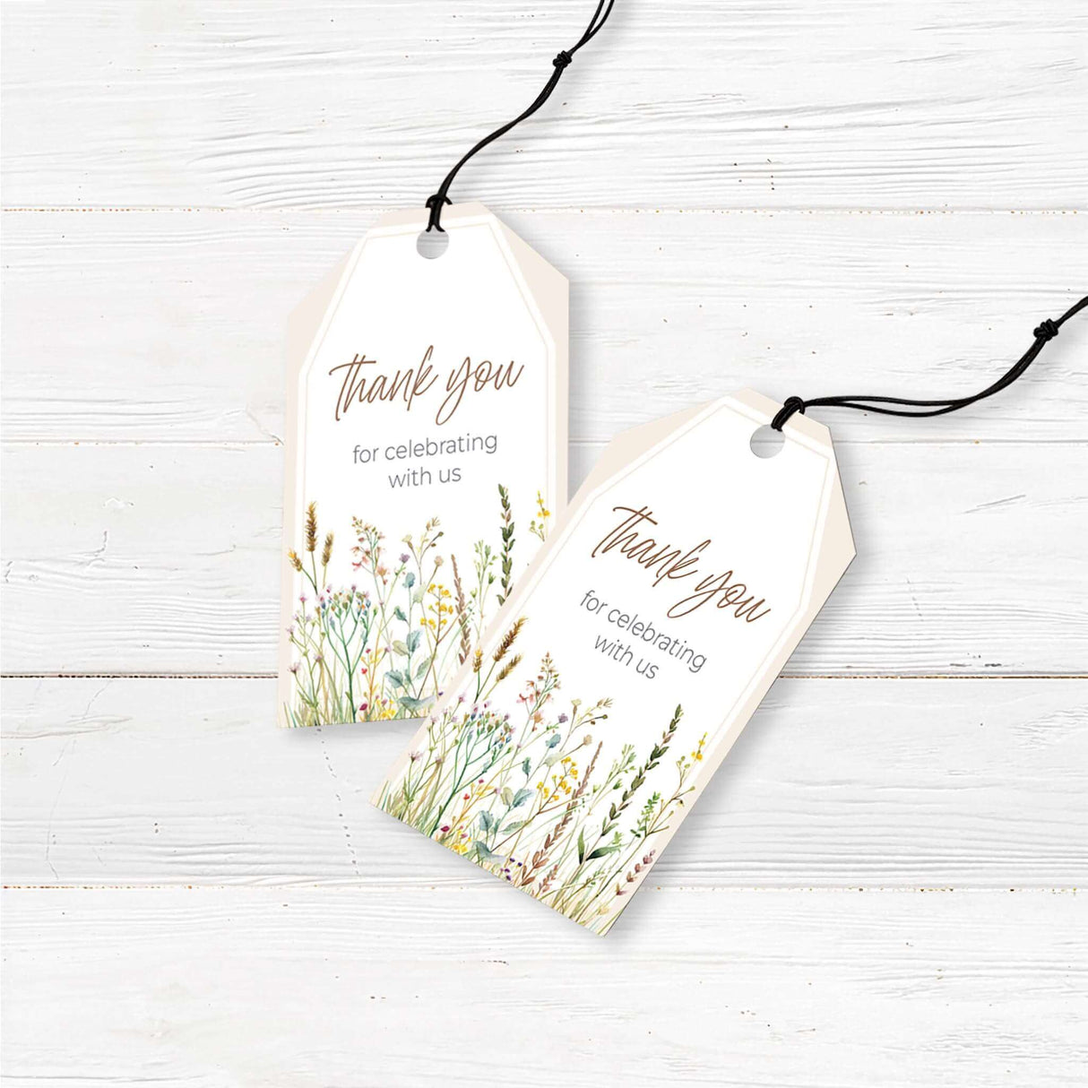 A set of small, rectangular favor tags with a soft, neutral background. The phrase 'Thank You for Celebrating with Us' is elegantly displayed in a stylish script or serif font. The design may include delicate floral accents, watercolor greenery, or baby-themed illustrations. Each tag has a hole punched at the top, making it easy to attach to favor bags, gifts, or party favors, adding a thoughtful and decorative touch to a baby shower or special event."