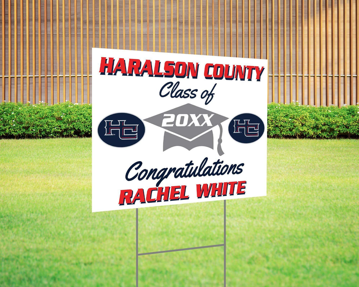 Graduation yard sign with bold text, custom school logo, class year, and congratulatory message. Features a large mortarboard cap graphic and varsity-style font. Printed on durable Coreplast plastic, perfect for outdoor display in front yards, driveways, and school events. Haralson County