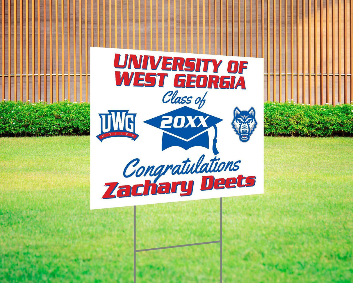 Graduation yard sign with bold text, custom school logo, class year, and congratulatory message. Features a large mortarboard cap graphic and varsity-style font. Printed on durable Coreplast plastic, perfect for outdoor display in front yards, driveways, and school events. UWG