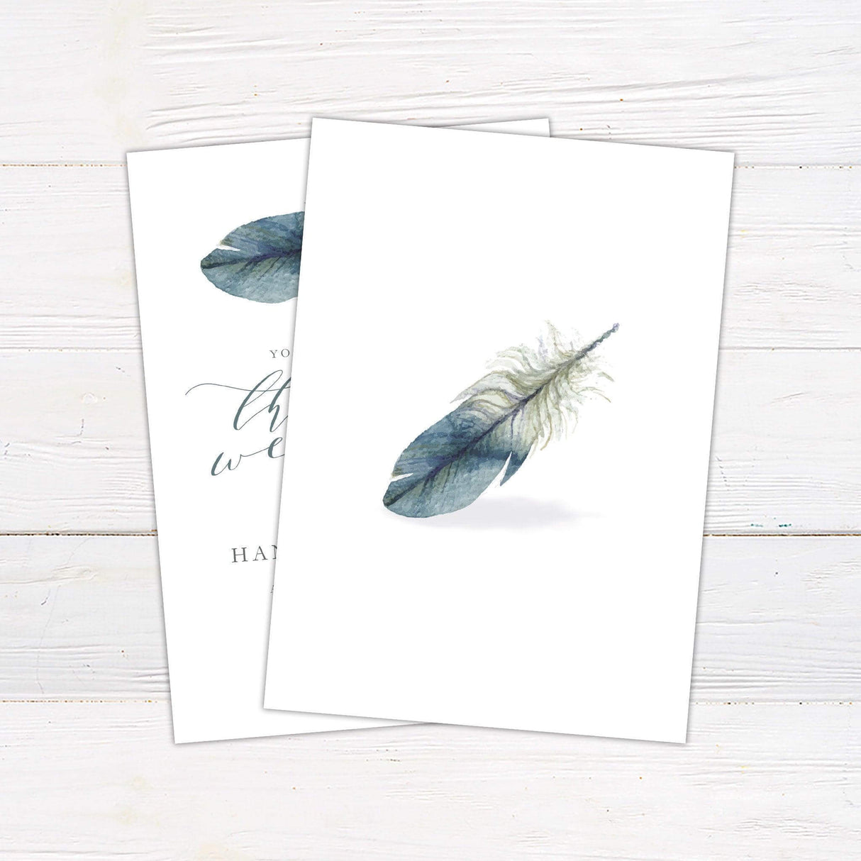 Minimalist wedding invitation with a watercolor feather and elegant script text. back