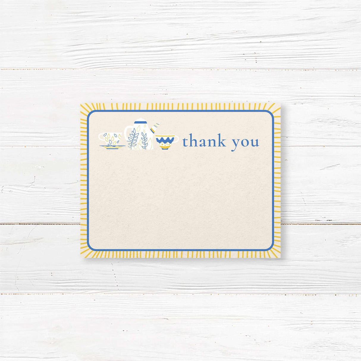 Bridal shower thank-you card featuring blue and gold teapot and teacup illustrations, printed on premium cardstock for an elegant tea party theme.