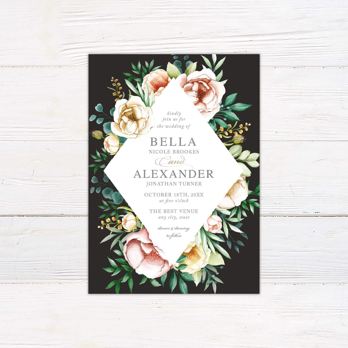 Wedding invitation with lush watercolor florals on a dark background, diamond-shaped white frame, and elegant script and serif text