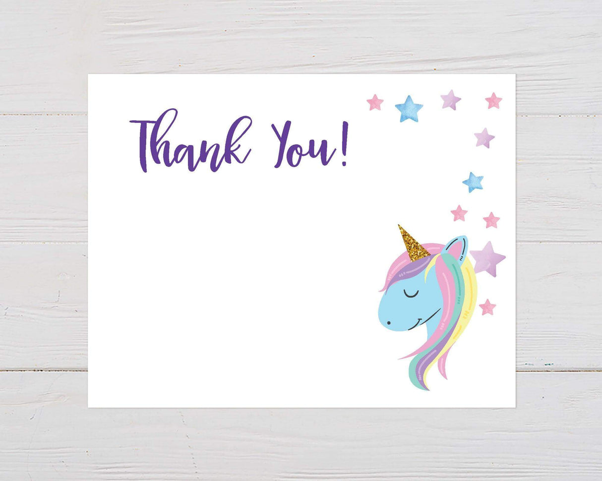 Colorful thank you card featuring a smiling unicorn with a rainbow mane and golden horn. The design includes pastel stars and whimsical typography on a clean white background.