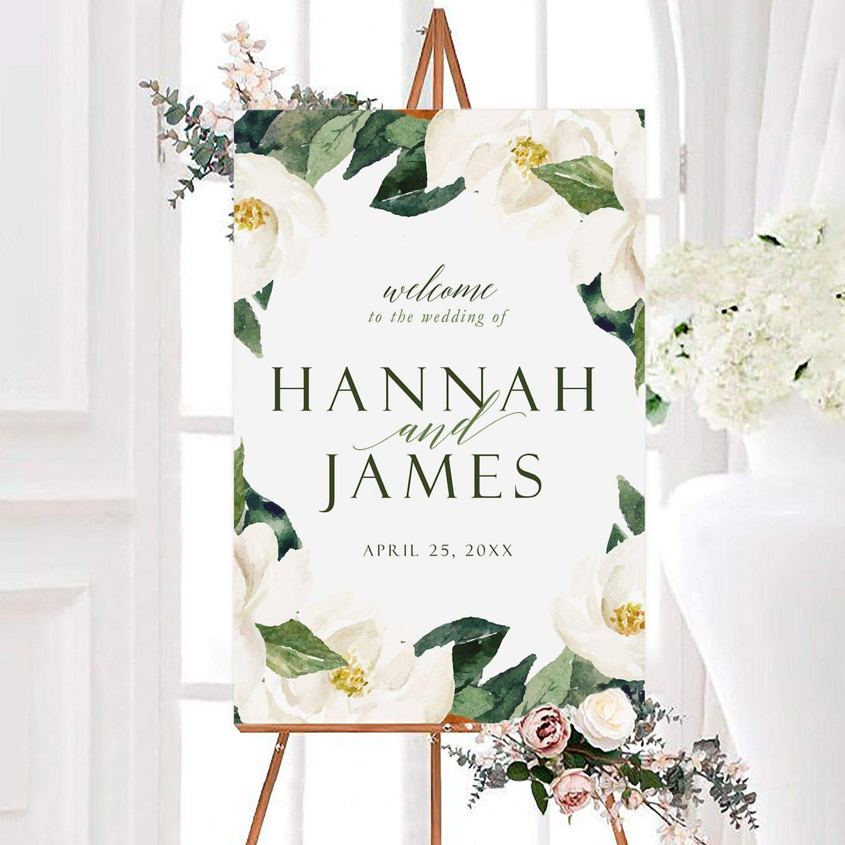 Magnolia floral wedding welcome sign featuring large white watercolor magnolia flowers, lush green leaves, and elegant personalized typography. A romantic botanical sign designed to welcome guests to a wedding ceremony or reception.