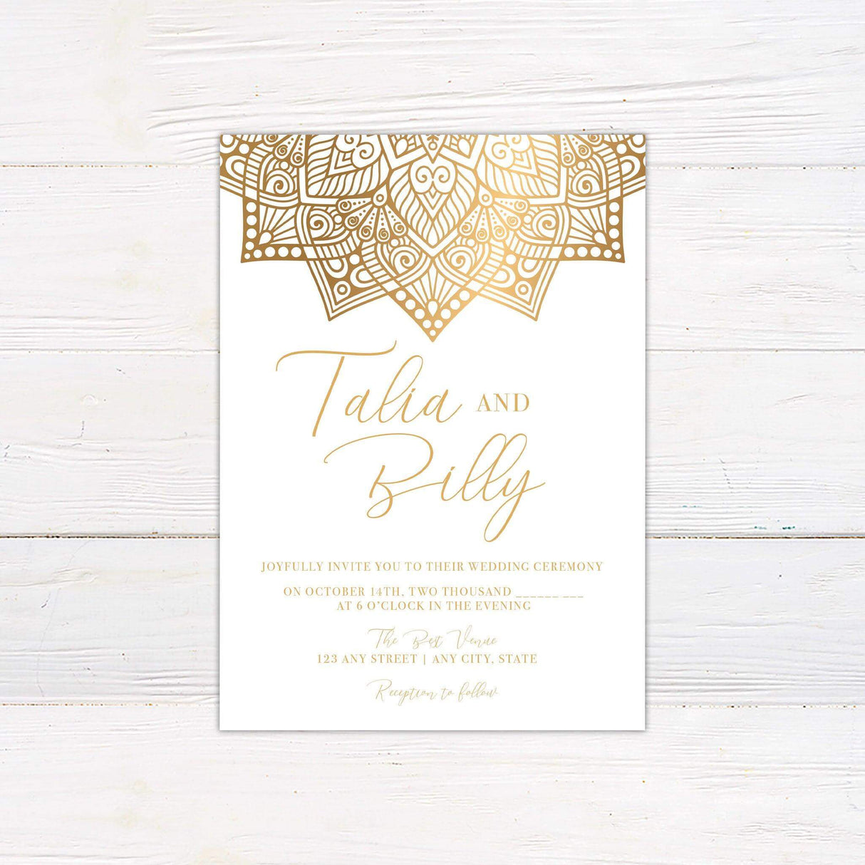Wedding invitation with gold mandala design at the top, elegant script and serif fonts, and customizable ceremony details on white background