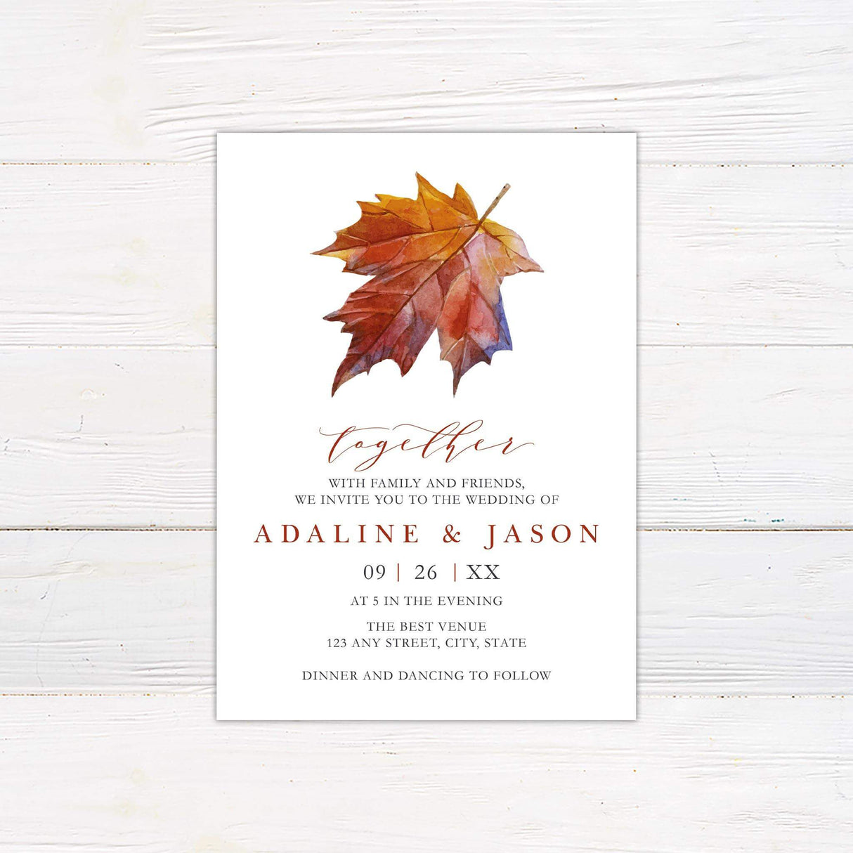 Wedding invitation with watercolor maple leaf in red, orange, and purple tones, paired with elegant serif and script fonts on a white background