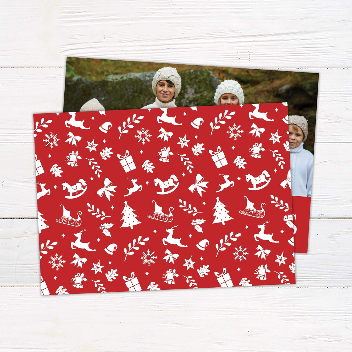 A holiday card design with a large family photo at the top and a bold red section at the bottom featuring the words “Merry Christmas” in elegant fonts. - back.