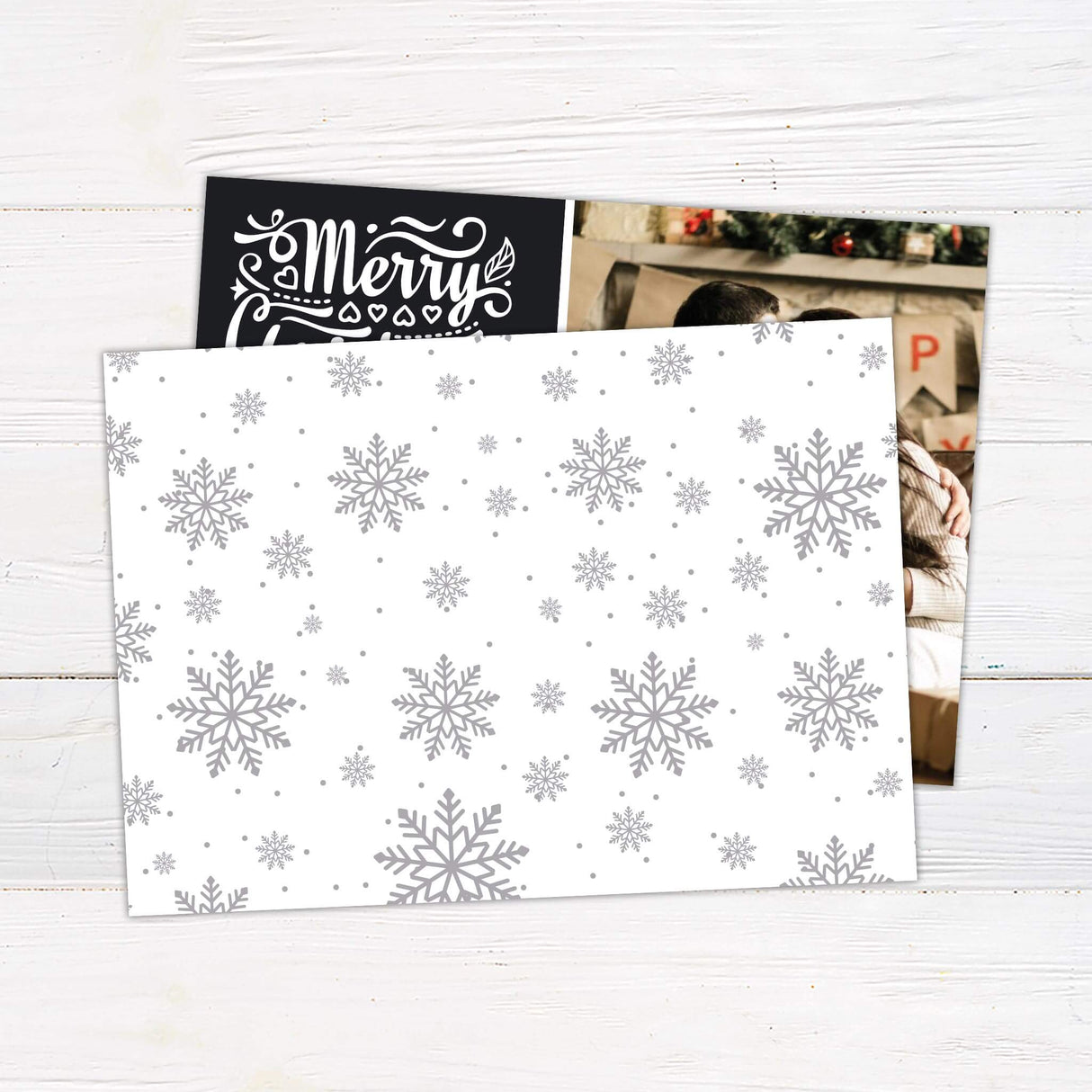 Personalized Merry Christmas photo collage card with bold script typography and space for family photos and custom name. back side