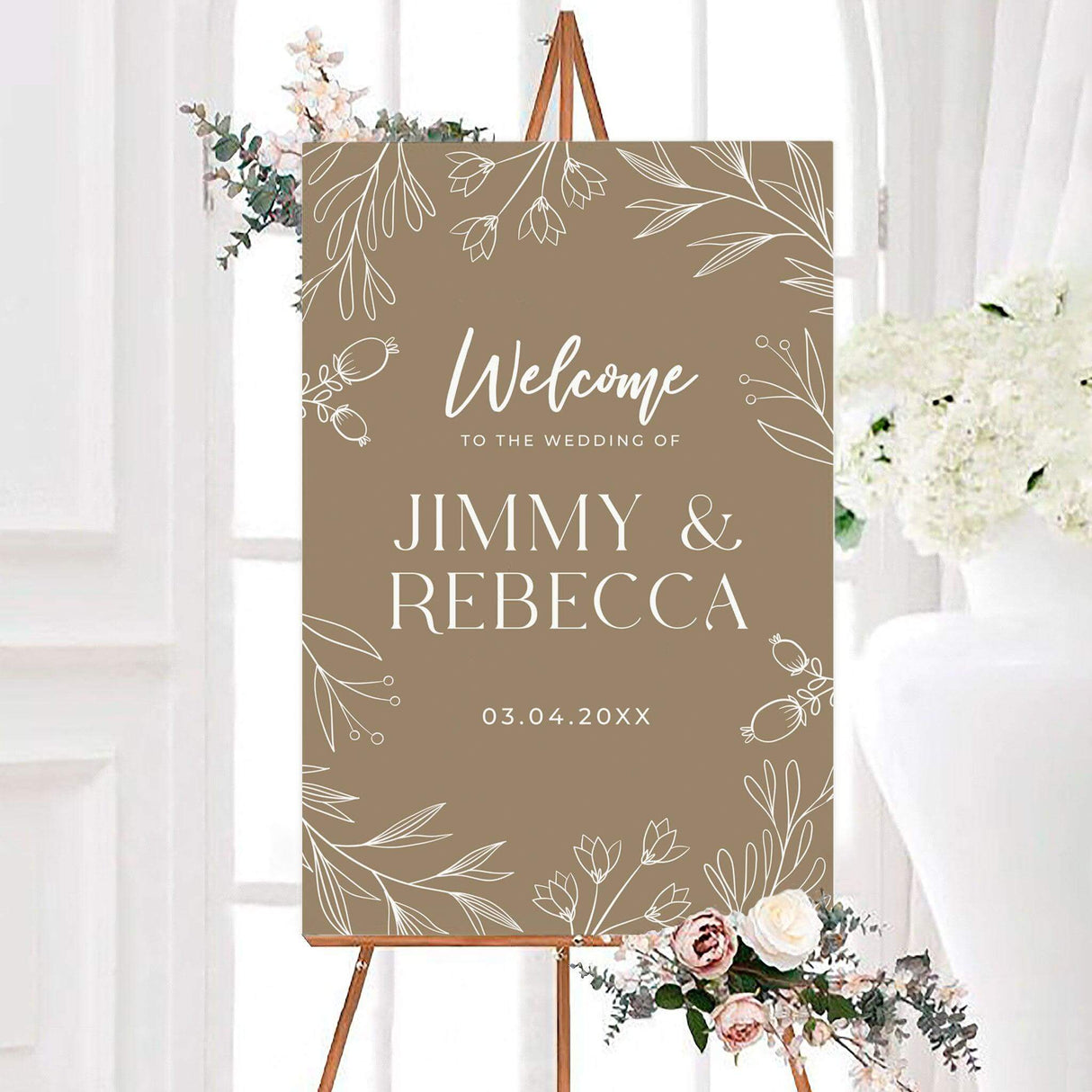 Taupe minimal foliage wedding welcome sign with white botanical line art, personalized couple names, and wedding date. Delicate leaves, berries, and floral branches frame the minimalist neutral design.
