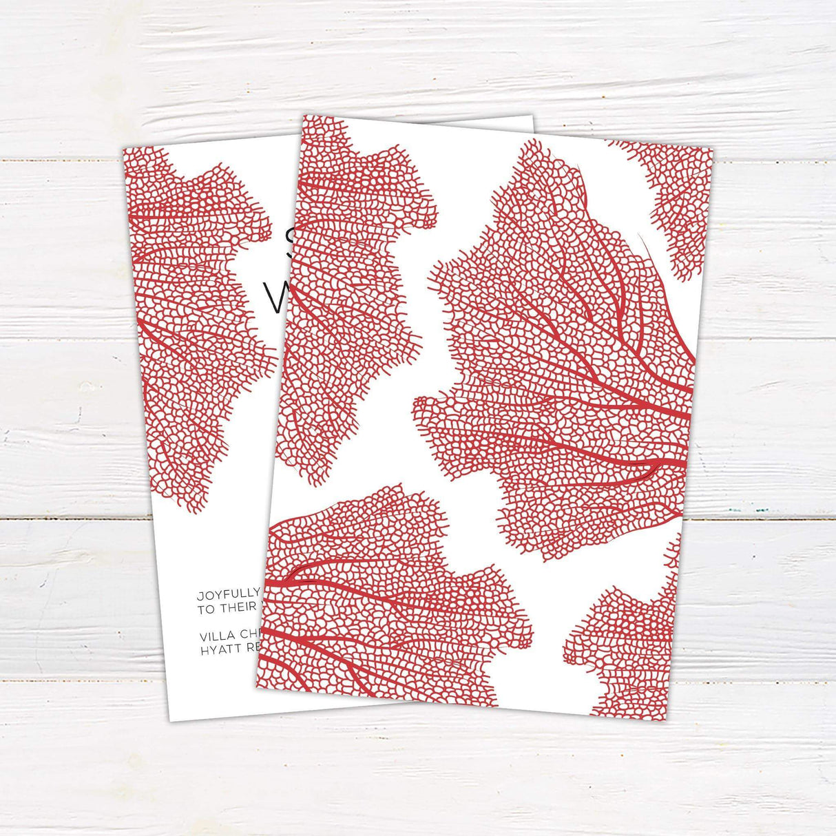 Modern wedding invitation with bold red botanical leaf design on the left, minimalist black sans-serif text on white background with clean layout - back
