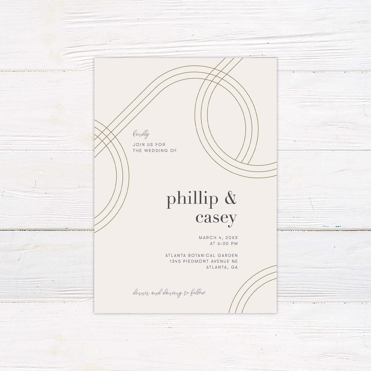 Minimalist printed wedding invitation with curved gold line design and modern typography on cream background