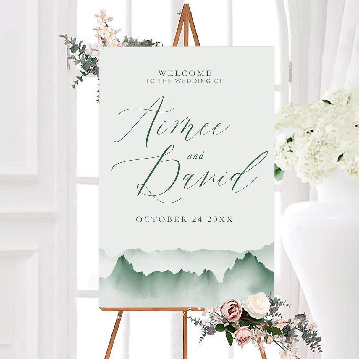 Misty mountains wedding welcome sign featuring soft green watercolor mountains and elegant personalized script typography. A scenic nature-inspired sign designed to welcome guests to a mountain or outdoor wedding.