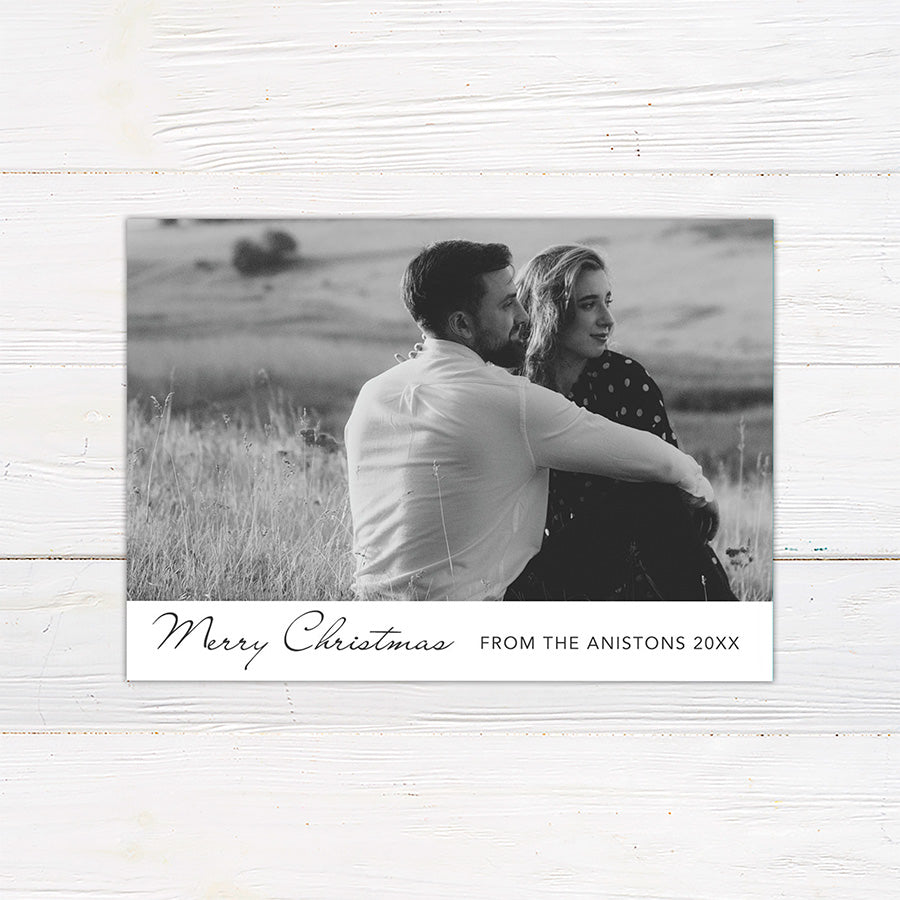 Personalized black and white Christmas photo card featuring a large couple's portrait with an elegant Merry Christmas greeting. The reverse includes multiple photo spaces for sharing additional favorite memories.