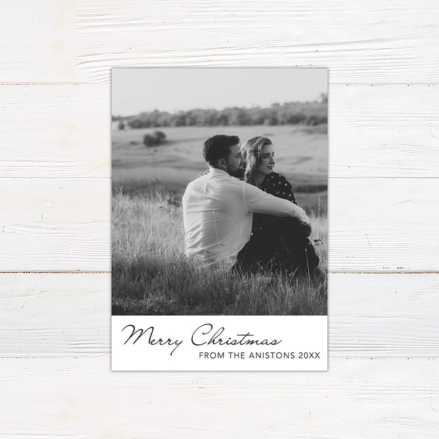 Personalized black and white Christmas photo card featuring a large couple's portrait with an elegant Merry Christmas greeting. The reverse includes multiple photo spaces for sharing additional favorite memories.