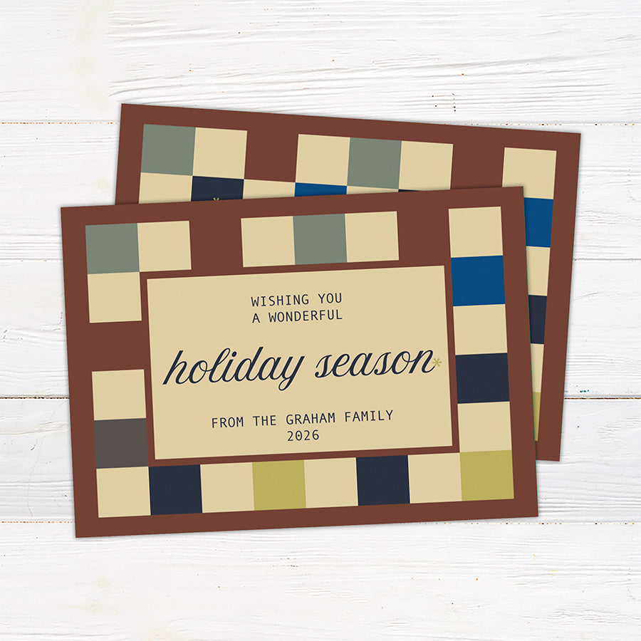 Personalized holiday card featuring a geometric color block pattern with a Happy Holidays greeting and custom family details. Coordinating options include a family photo layout and personalized seasonal message.