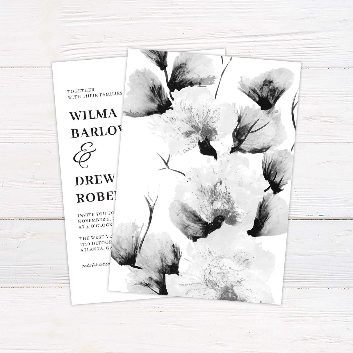 Black and white wedding invitation with large monochrome watercolor florals and elegant serif typography in a vertical layout - back