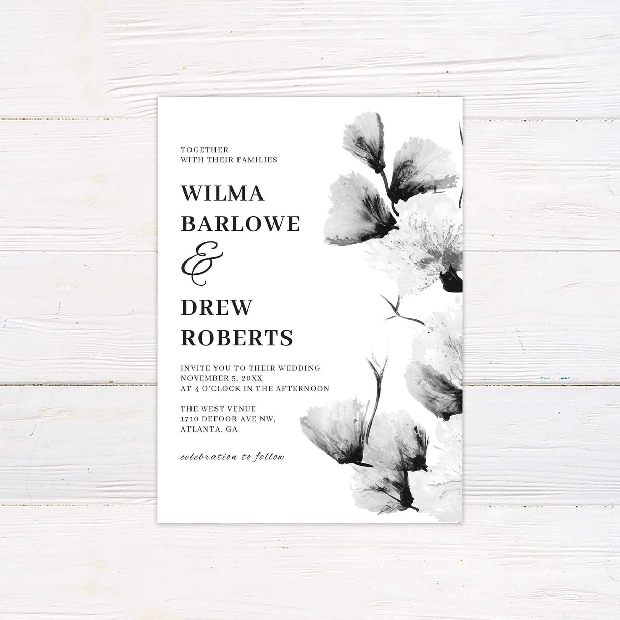 Black and white wedding invitation with large monochrome watercolor florals and elegant serif typography in a vertical layout
