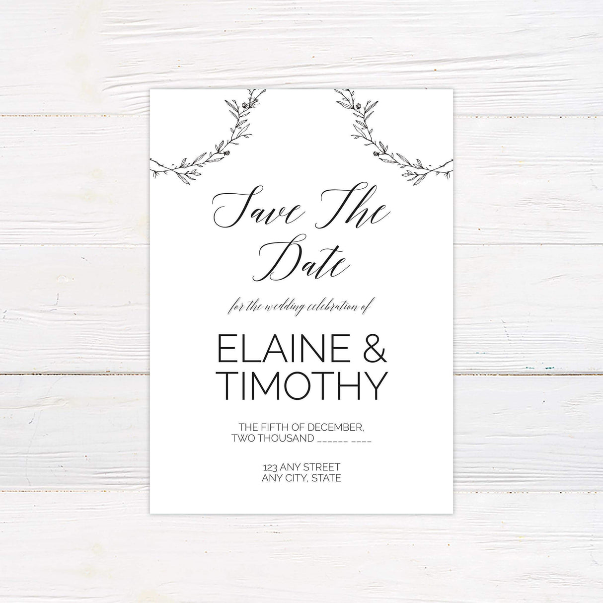 Monochrome save the date card featuring botanical wreath and modern script typography, coordinating with rustic wedding invitation suite.