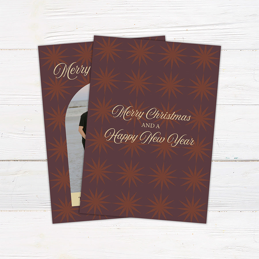 Personalized Christmas photo card featuring a family portrait framed by a retro starburst pattern and Merry Christmas greeting. The back includes coordinating starbursts with a Christmas and New Year message.