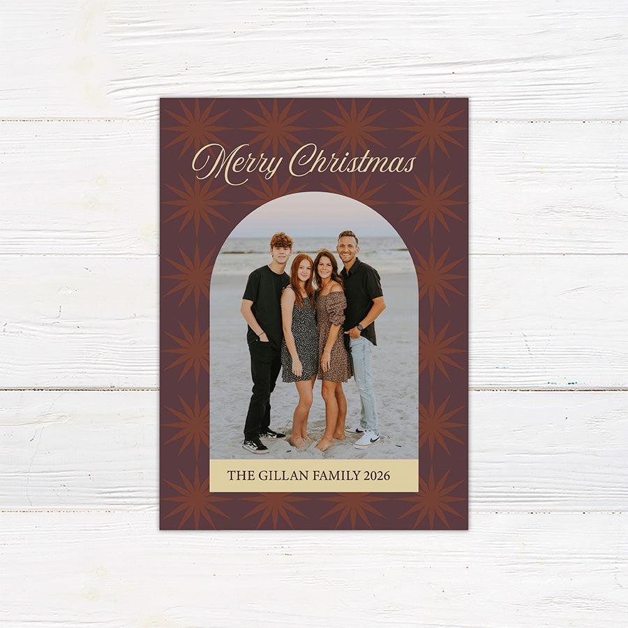 Personalized Christmas photo card featuring a family portrait framed by a retro starburst pattern and Merry Christmas greeting. The back includes coordinating starbursts with a Christmas and New Year message.