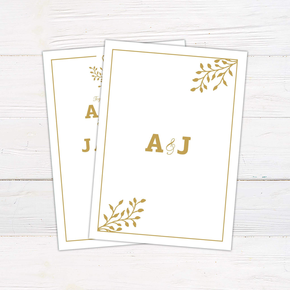 Gold wedding invitation with monogram shield crest, bold serif names, elegant script details, and formal layout with border on white background - back side