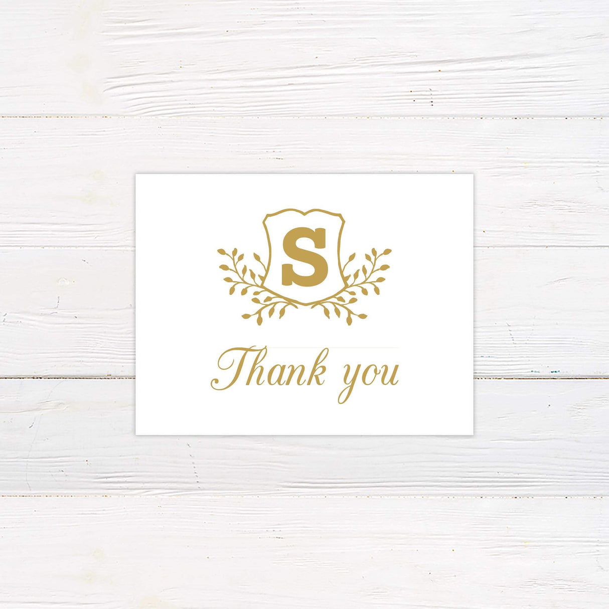 Gold thank you card with classic serif and script fonts, matching formal monogram wedding stationery suite.