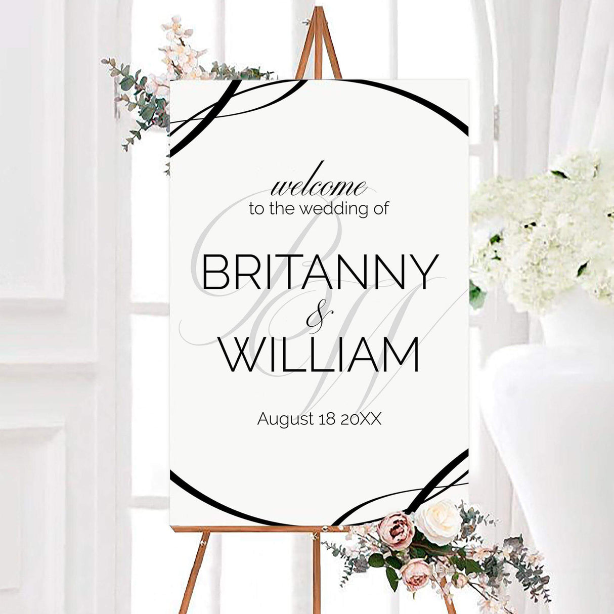Wedding welcome sign with bold oversized monogram and minimalist black and white layout, ideal for formal or contemporary weddings.