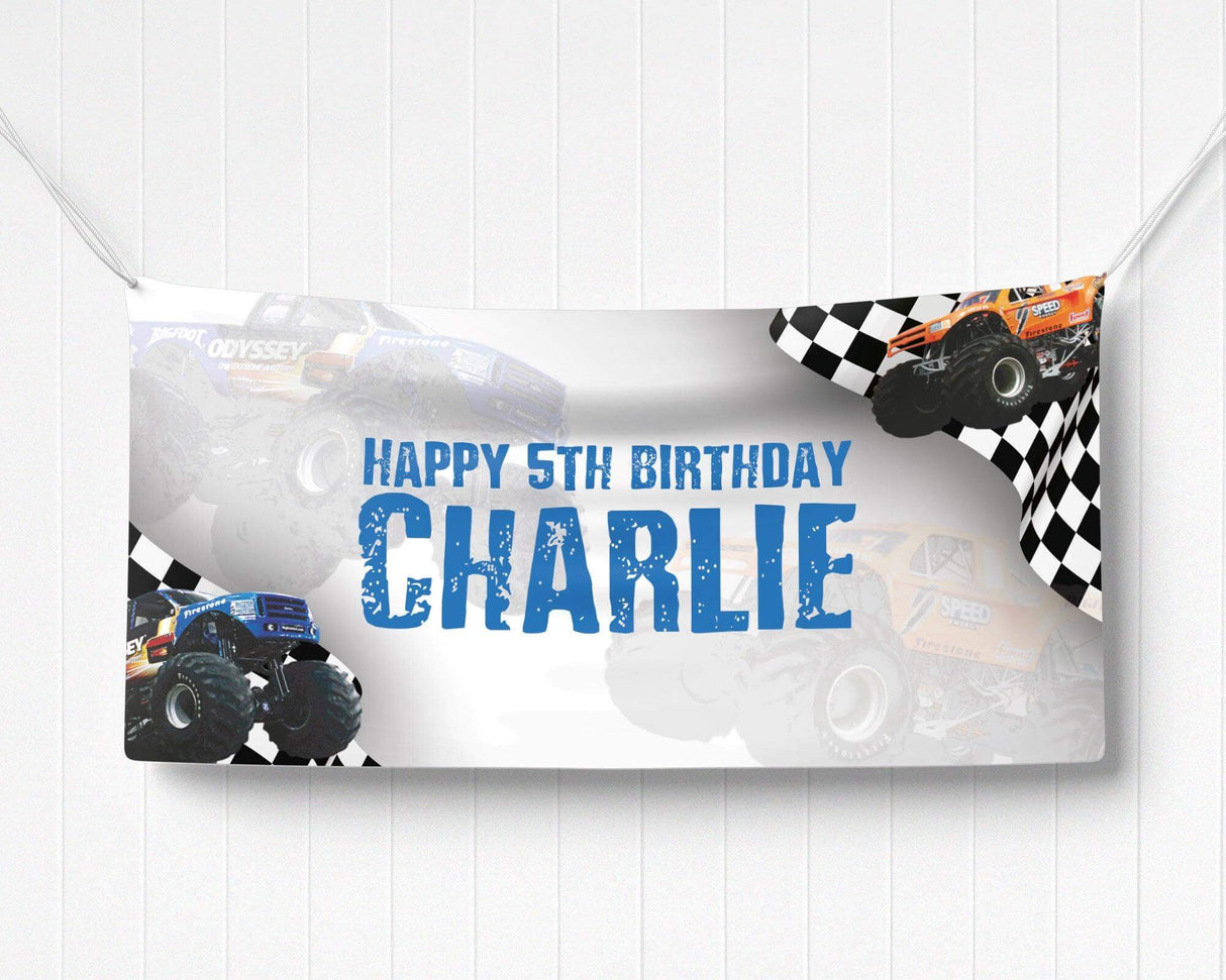 Monster truck birthday banner featuring bold black and blue design with checkered racing flags, oversized monster trucks, and rugged typography. Perfect for a high-energy, race-themed birthday party.