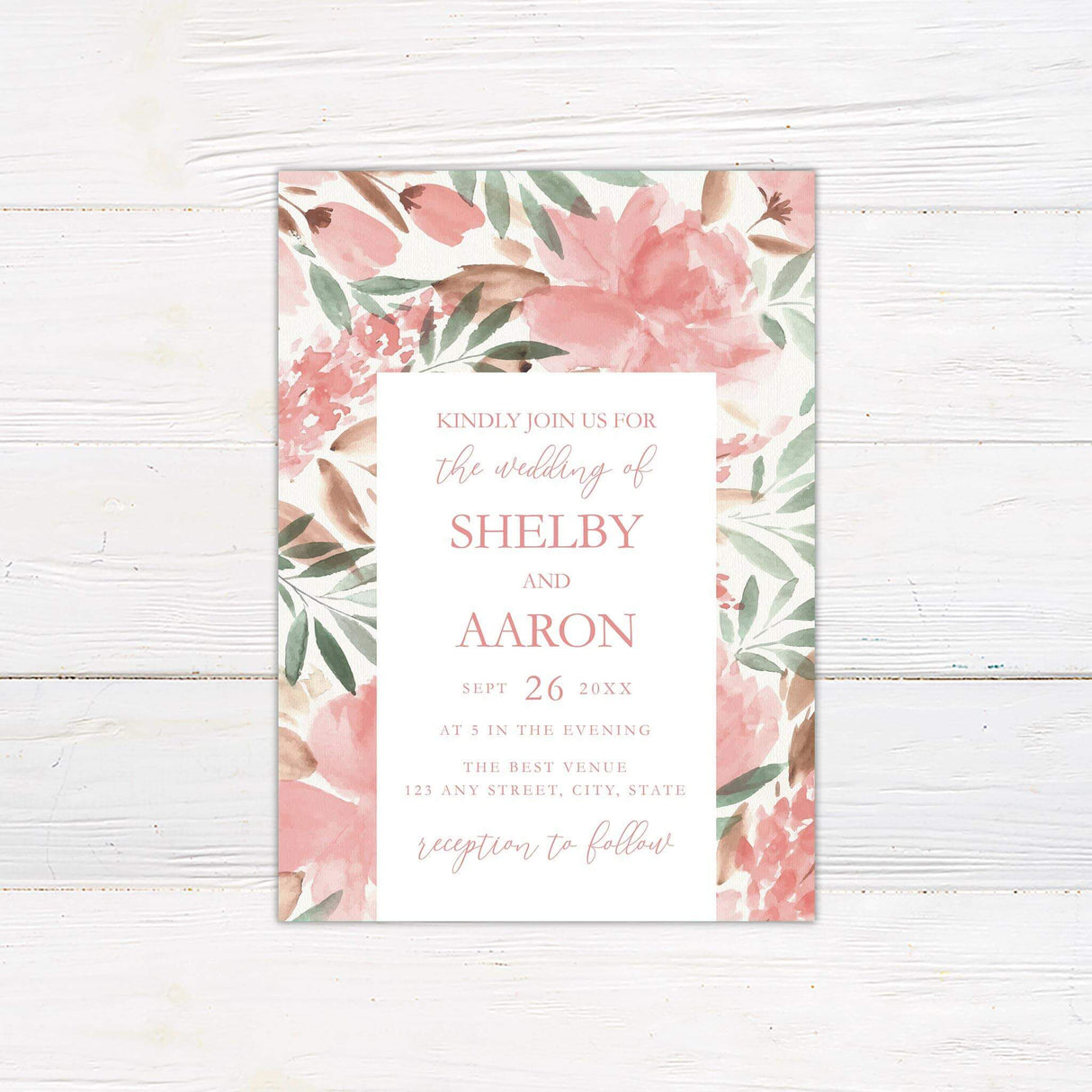 Watercolor wedding invitation with blush pink florals, green leaves, and romantic script and serif fonts on white background